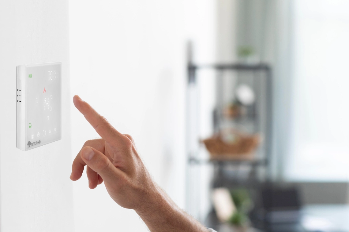 A Mycond Block thermostat with temperature settings displayed.