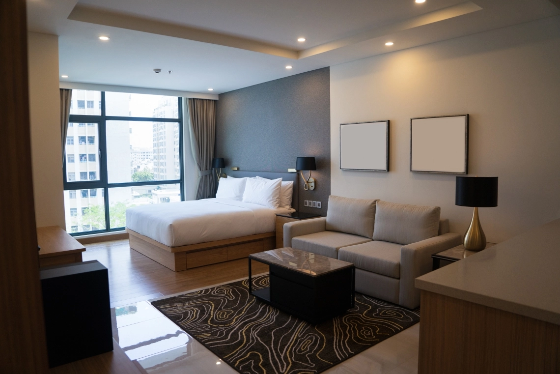 Modern cozy studio apartment showcasing a fan coil unit integration.