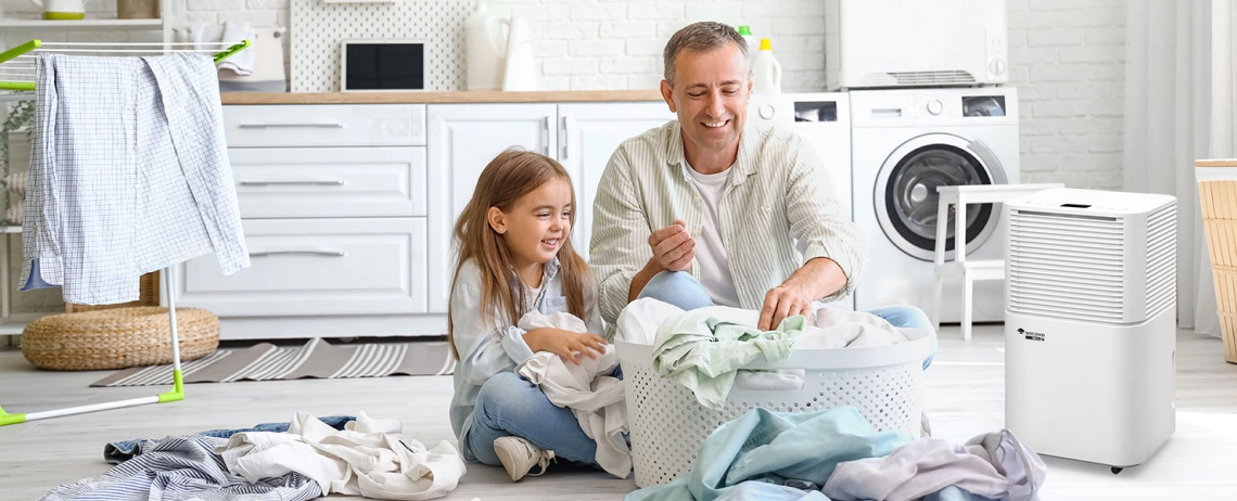 A father and daughter enjoying a dry and comfortable room with the Mycond TIBO Eco 10 air dehumidifier.