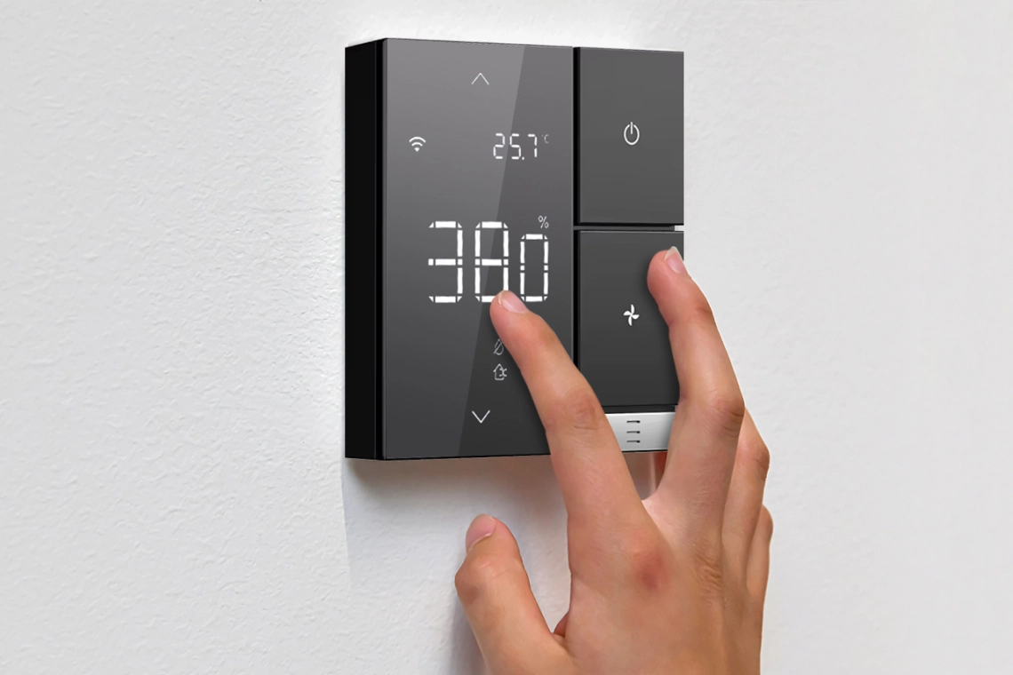 Wall-mounted Mycond Link humidistat with intuitive interface and Wi-Fi connectivity for smart humidity control.