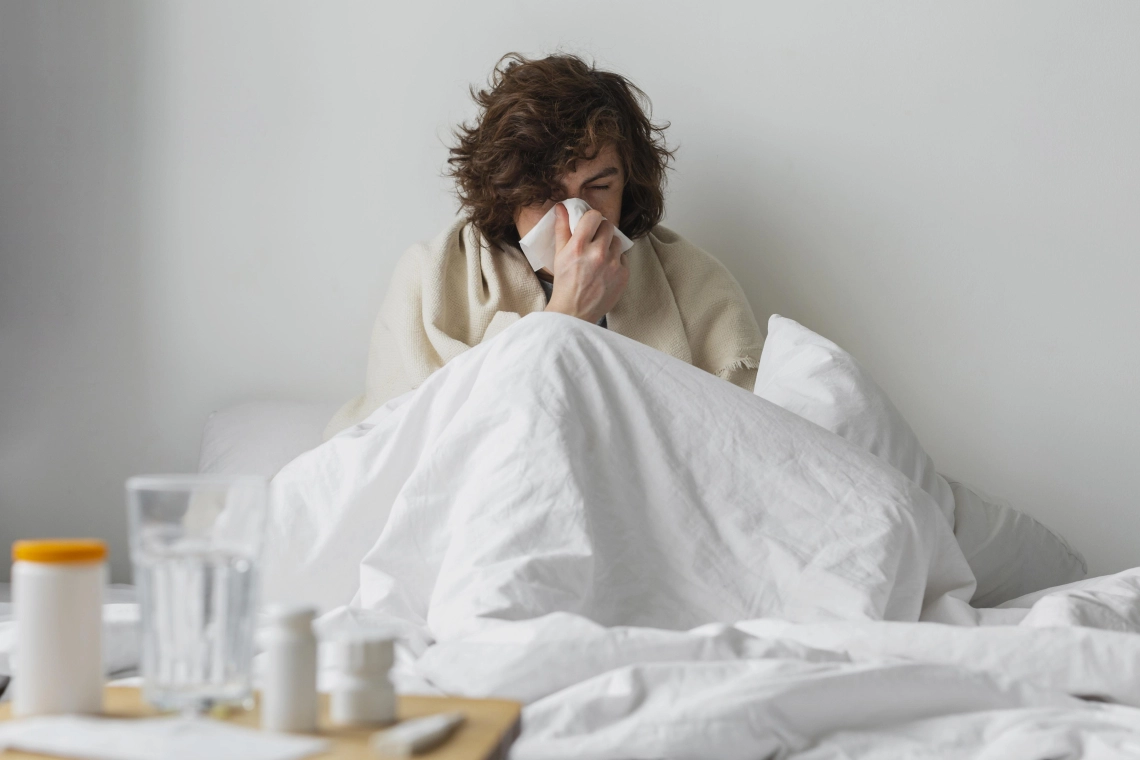 young sick man staying his bed